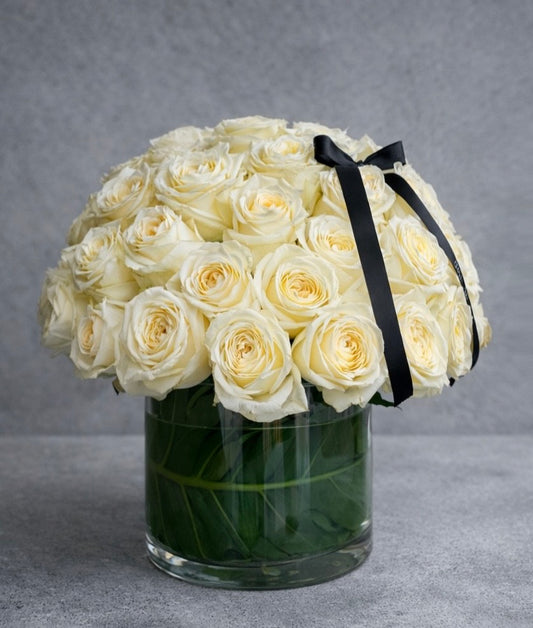Ivory Roses in Glass Vase
